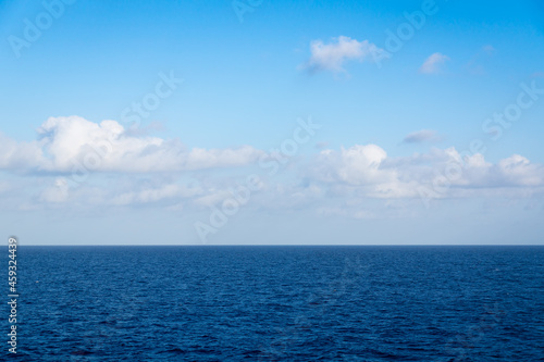 Seascape. Blue sky and white cloud.