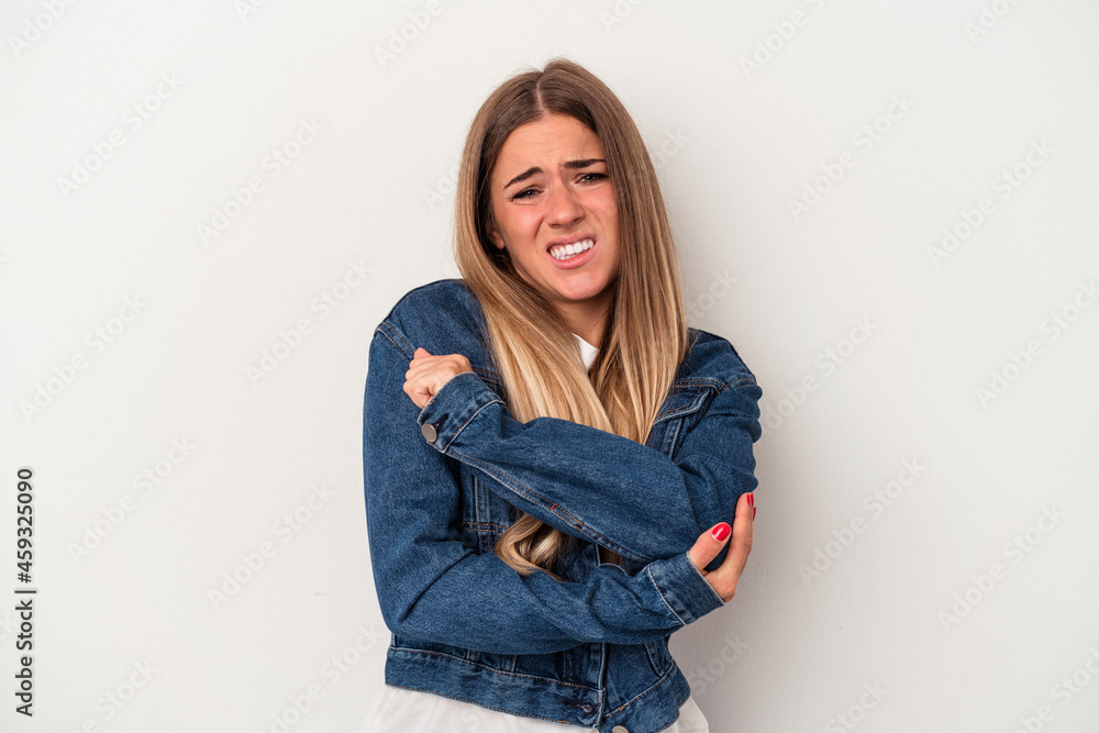 Young Russian woman isolated on white background having a shoulder pain. Young Russian woman isolated on white background having a shoulder pain.