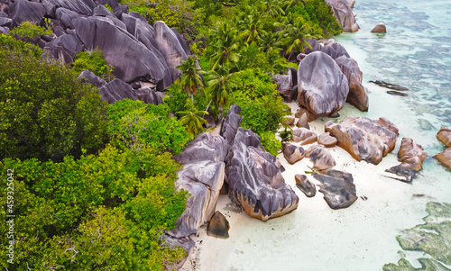 Top view of a summer ocean beach in the seychelles. Rocks and stones