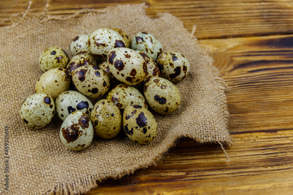 Quail eggs on a wooden table Quail eggs on a wooden table