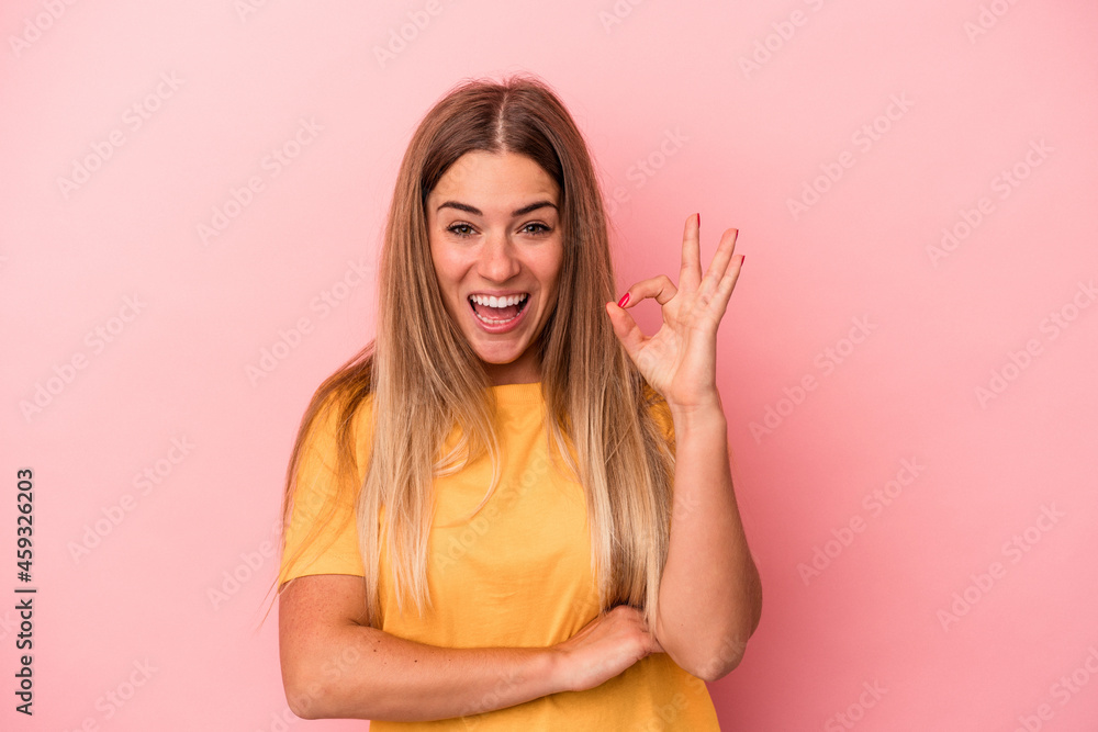 Young Russian woman isolated on pink background raising both thumbs up, smiling and confident. Young Russian woman isolated on pink background raising both thumbs up, smiling and confident.
