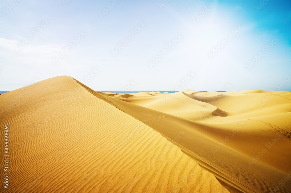 Blue sky and sand dunes in sunny day.