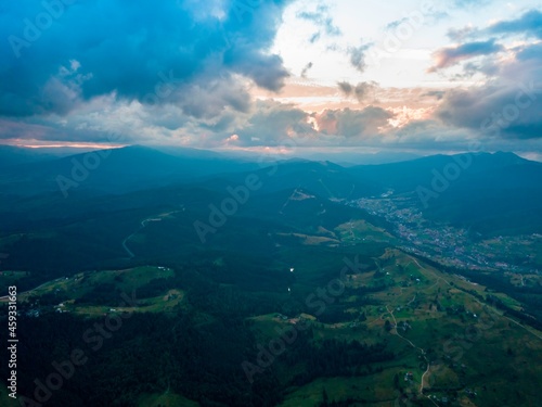 Sunset in the mountains. Ukrainian Carpathians in the evening. Aerial drone view.