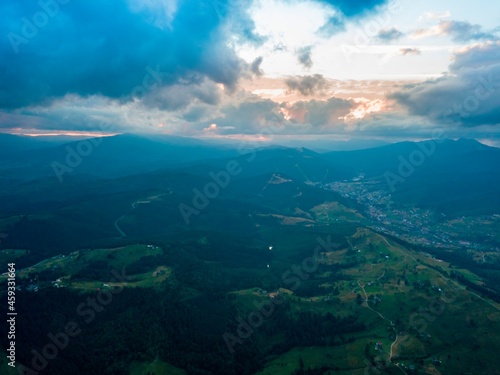 Sunset in the mountains. Ukrainian Carpathians in the evening. Aerial drone view.