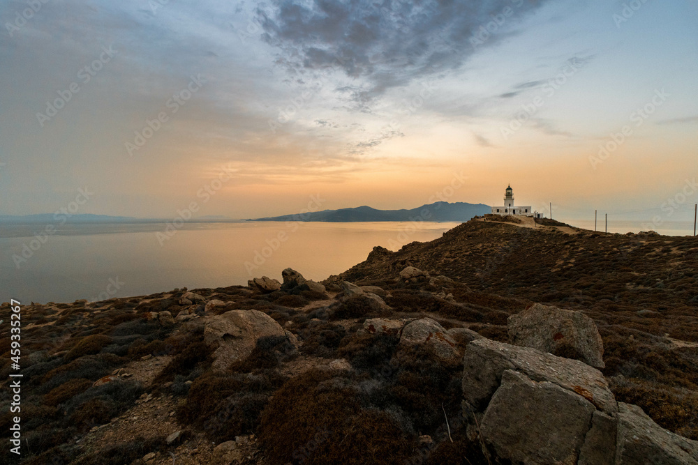 Lighthouse on the Coastline at Sunset in Mykonos Greece
