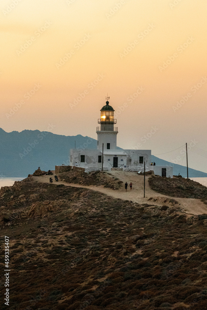 Lighthouse on the Coastline at Sunset in Mykonos Greece