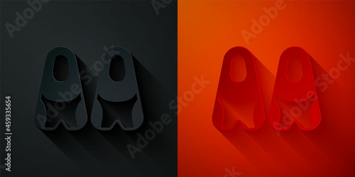Paper cut Rubber flippers for swimming icon isolated on black and red background. Diving equipment. Extreme sport. Diving underwater equipment. Paper art style. Vector