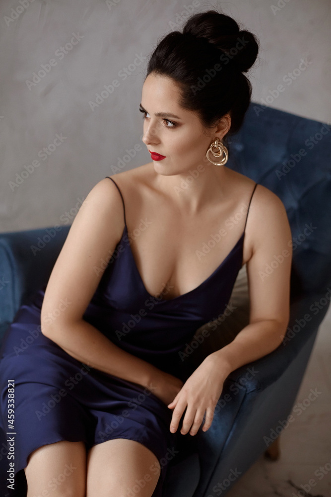 Model woman with perfect fashion makeup and modish hairstyle in the waiting for New Year's party Model woman with perfect fashion makeup and modish hairstyle in the waiting for New Year's party