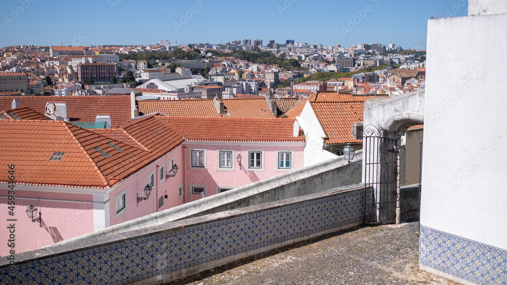 Top view of the Lisbon city from one of the streets of the Alfama district, Portugal.