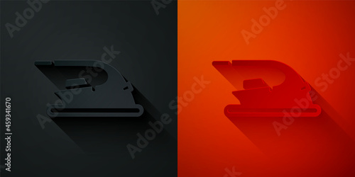 Paper cut Electric iron icon isolated on black and red background. Steam iron. Paper art style. Vector