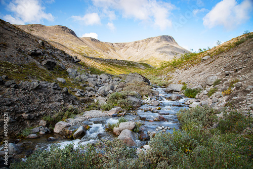 landscape of the Khibiny mountains with rocks and a mountain stream on a sunny day. Kola Peninsula, Russia © Kufotos