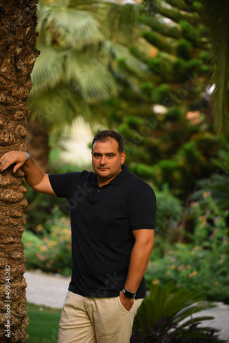 Handsome middle age man outdoor portrait in a park.