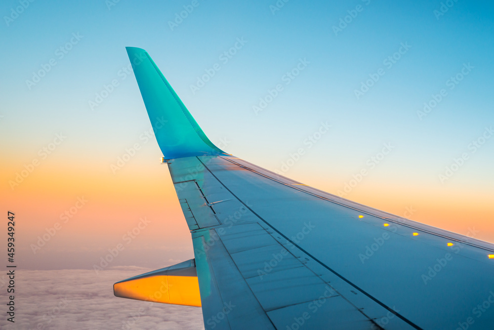 Sunset over the clouds
View from inside an aircraft over the aircraft wing to a colourful horizon at sunset. Sunset over the clouds
View from inside an aircraft over the aircraft wing to a colourful horizon at sunset.