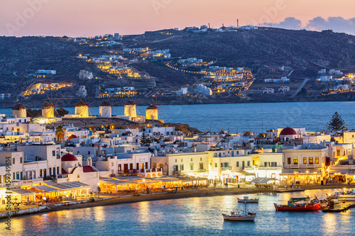 Billede på lærred Chora port of Mykonos island with famous windmills, ships and yachts during colorful sunset