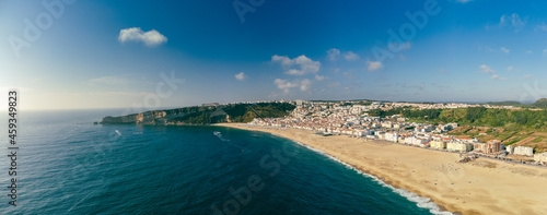 Aerial drone view of Nazare, Portugal - town, ocean and beach