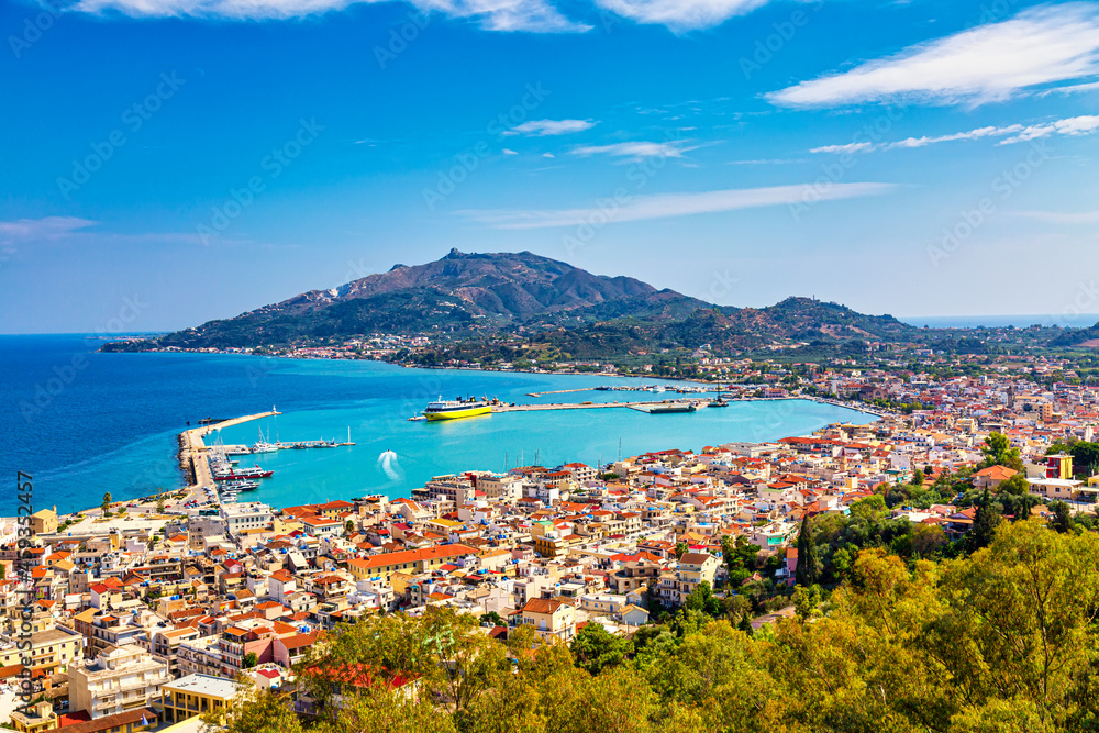 Aerial panoramic cityscape view of Zakynthos city, capital of the island Zakynthos in the Ionian sea in Greece. Summer sunny day - obrazy, fototapety, plakaty 