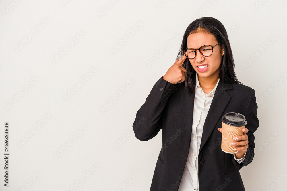 Young business latin woman holding a take away coffee isolated on white background showing a disappointment gesture with forefinger. Young business latin woman holding a take away coffee isolated on white background showing a disappointment gesture with forefinger.