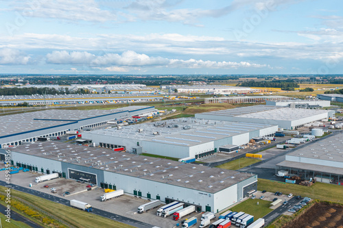 Aerial view of large warehouse. Logistics center in industrial city zone from above.