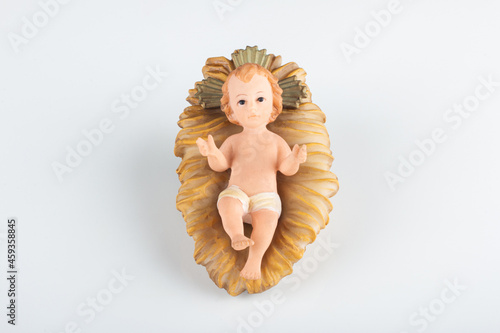 Fotografie Nativity scene figurine of baby jesus with white background