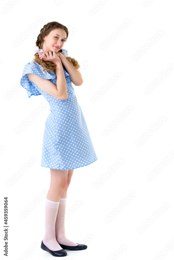 Smiling teen girl with braids in polka dot dress Smiling teen girl with braids in polka dot dress