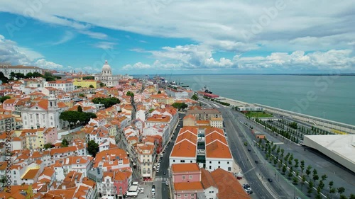 Aerial drone view of the cityscape of Alfama, sunny day, in Lisbon, Portugal photo