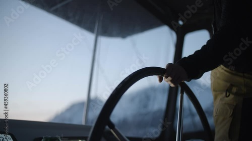 Sail boat wheel in arctic waters