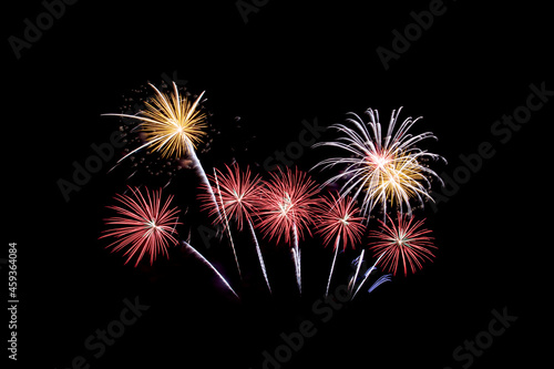 Many flashing colorful fireworks in event amazing with black background celebrate New Year  holiday and festival in night.