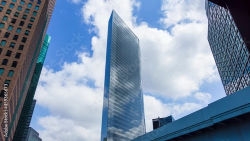 Timelapse stock footage of clouds and blue sky with office buildings, Tokyo, Japan
