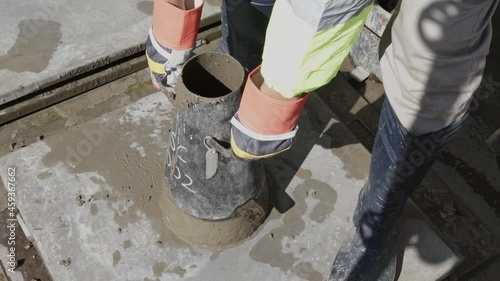 Lifting And Inverting Slump Cone Mold Then Measures Height Difference. high angle