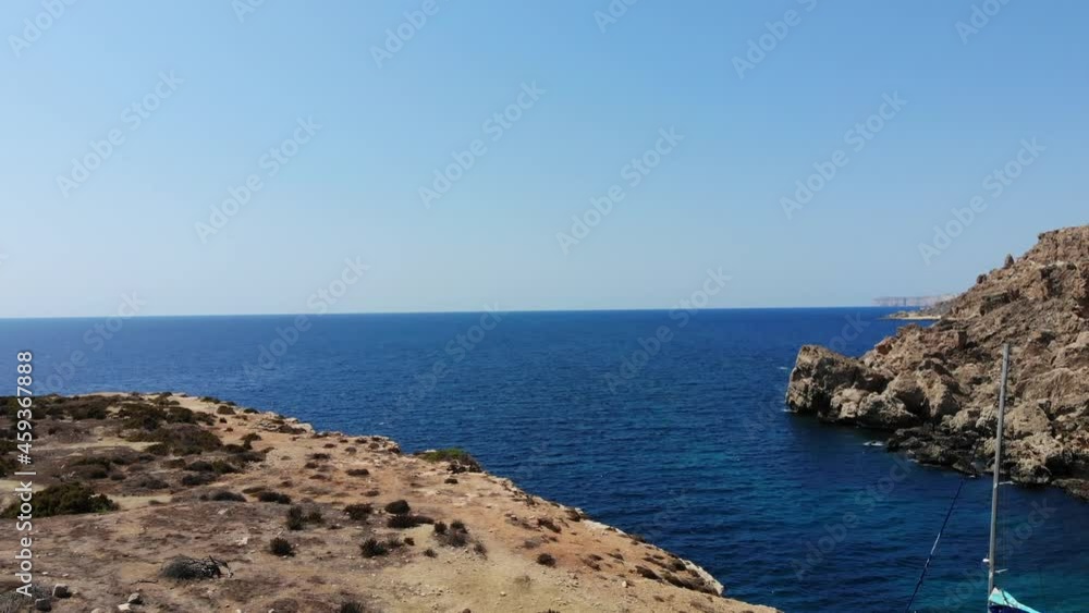 Drone view of the majestic Anchor Bay from the picturesque tourist destination at Popeye Village, Malta. Drone view of the majestic Anchor Bay from the picturesque tourist destination at Popeye Village, Malta.