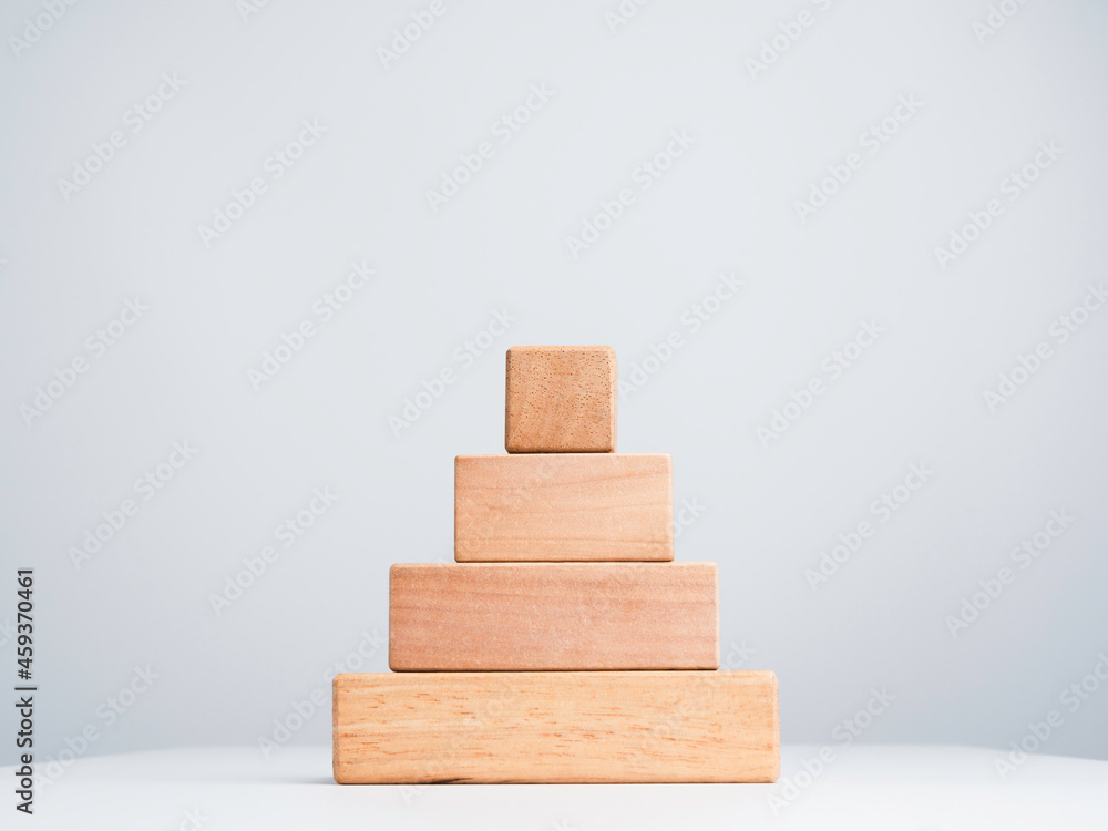 Blank business chart steps made by stack of wooden cube blocks in pyramid shape isolated on white background, eco friendly and minimal style. Blank business chart steps made by stack of wooden cube blocks in pyramid shape isolated on white background, eco friendly and minimal style.