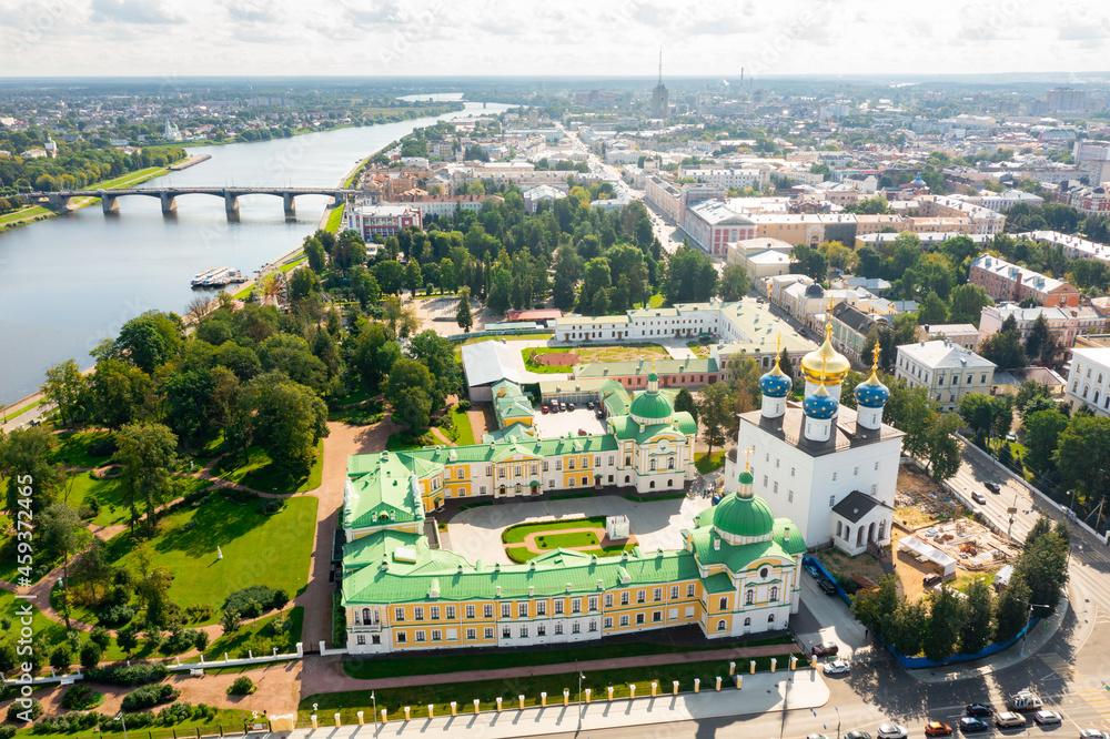 Aerial view of modern Tver cityscape overlooking Transfiguration Cathedral and Imperial Traveling Palace on bank of Volga river on sunny summer day, Russia