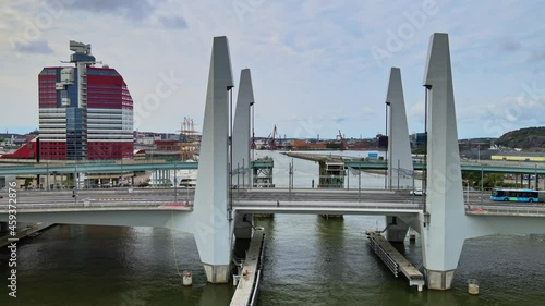 Public Transportation Crossing At Hisingsbron Bridge Over Gota Alv River In Gothenburg, Sweden.- aerial photo