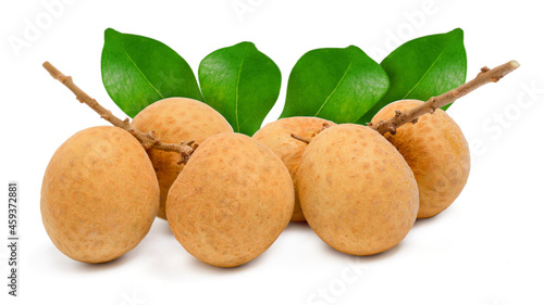 Fresh longan fruit with leaves and seed on white background.