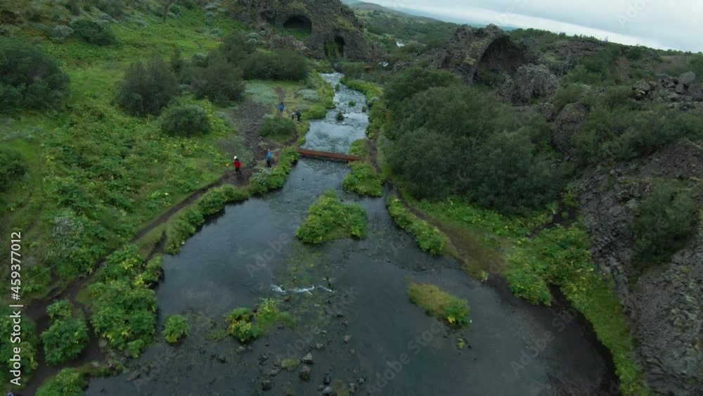 FPV shot over gentle flowing Gjain waterfalls in Iceland, scenic valley FPV shot over gentle flowing Gjain waterfalls in Iceland, scenic valley