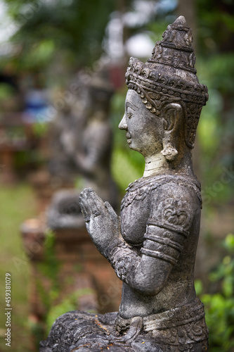 Ancient Buddha statue  closeup. In a quiet and comfortable natural environment 