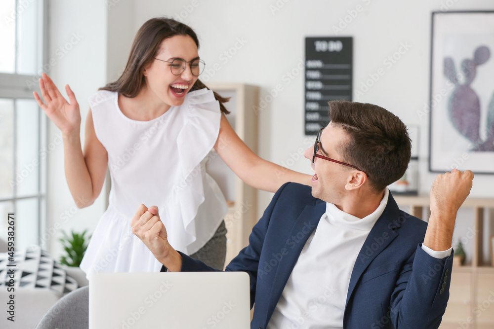 Happy colleagues working in office Happy colleagues working in office