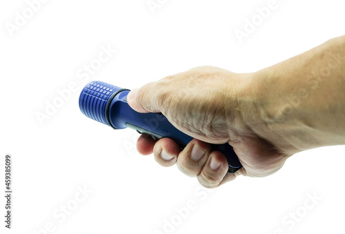 Hand holding a blue portable flashlight against a white background