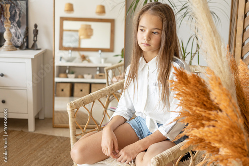 Tableau sur toile portrait of thoughtful beautiful teenage girl with long hair in white shirt and