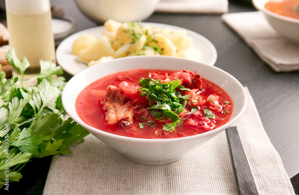 Bowl with delicious borscht on table Bowl with delicious borscht on table