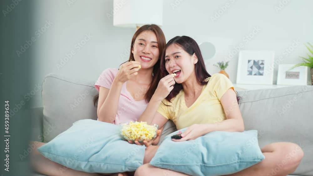 Asian beautiful lesbian woman couple enjoy watch TV together in house. Asian beautiful lesbian woman couple enjoy watch TV together in house.