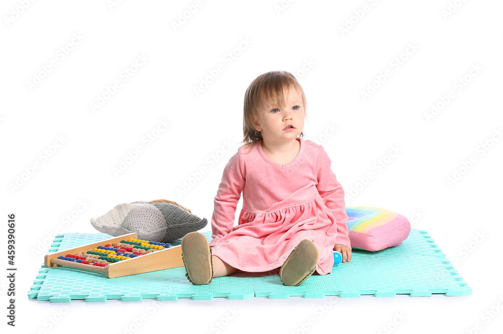 Cute baby girl with toys on white background Cute baby girl with toys on white background