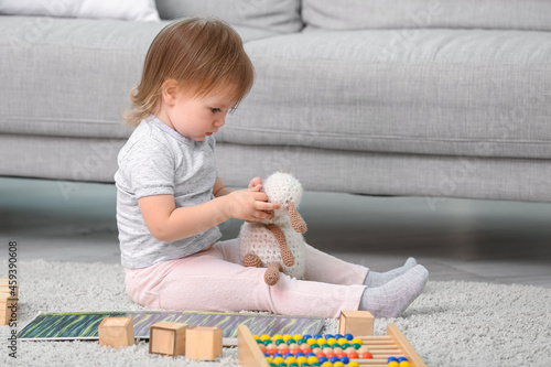 Cute baby girl playing at home