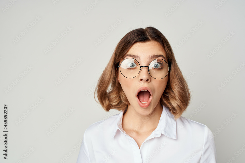 emotional business woman in white shirt round glasses close up emotional business woman in white shirt round glasses close up