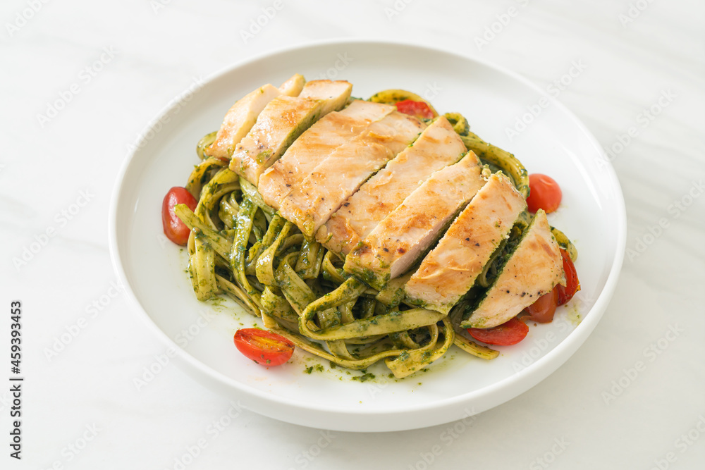 fettuccine spaghetti pasta in pesto sauce with grilled chicken fettuccine spaghetti pasta in pesto sauce with grilled chicken
