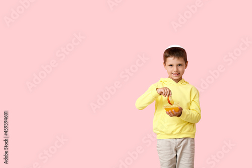 Little boy with honey on co...