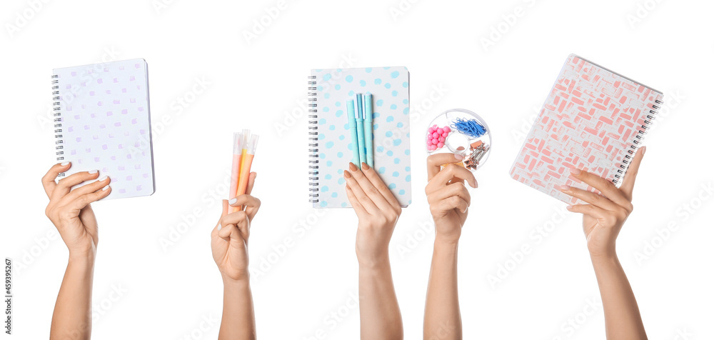 Many different hands with school supplies on white background Many different hands with school supplies on white background