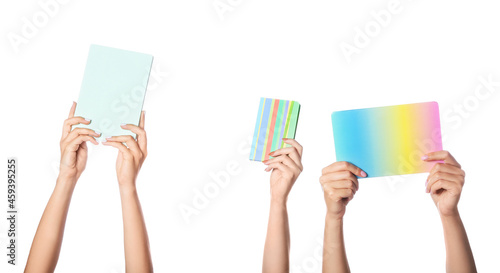 Female hands with different notebooks on white background