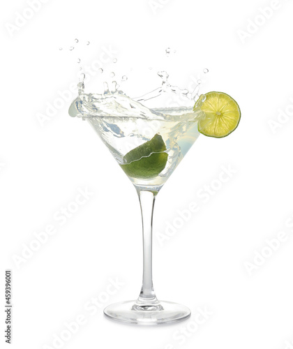 Glass of tasty margarita cocktail with splashes on white background