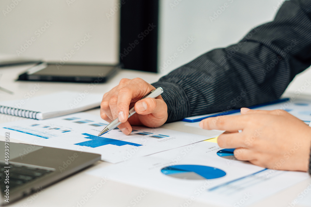 Close up view of bookkeeper or financial inspector hands making report, calculating or checking balance. Home finances, investment, economy, saving money or insurance concept. Close up view of bookkeeper or financial inspector hands making report, calculating or checking balance. Home finances, investment, economy, saving money or insurance concept.